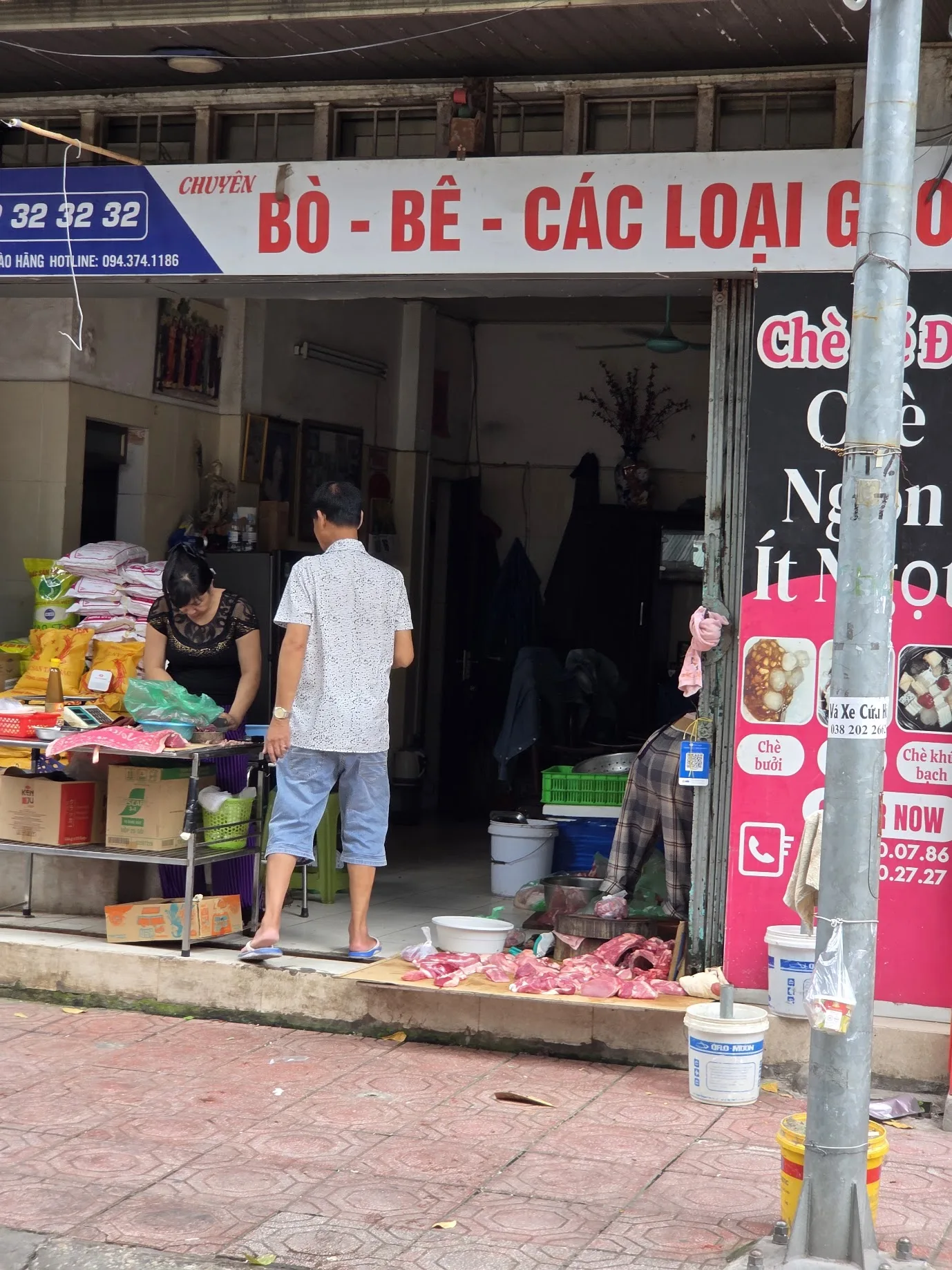 A Hanoi butcher shop spilling out onto the pavement